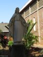 Oakford Priory Church - Statue in Quadrangle